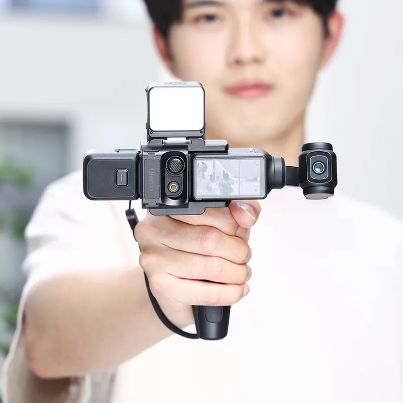 User holding Ulanzi PK-06 Expansion Adapter attached to DJI Osmo Pocket 3