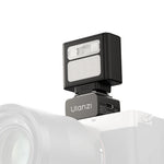 Ulanzi LA10 Mini Flash Trigger C059 attached to a camera hot shoe.