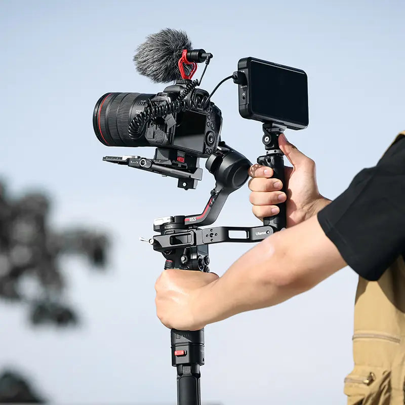 Ulanzi Sling Handgrip with DSLR camera and monitor in outdoor setup.