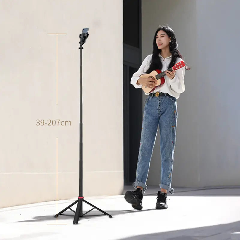 Ulanzi MT-79 light stand next to woman holding ukulele, showcasing height range.