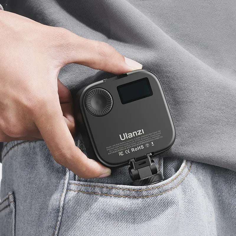 Compact Ulanzi U60 RGB video light easily fits in a pocket, featuring an LCD display.