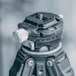 Falcam F38 quick release plate attached to tripod head for secure camera mounting.