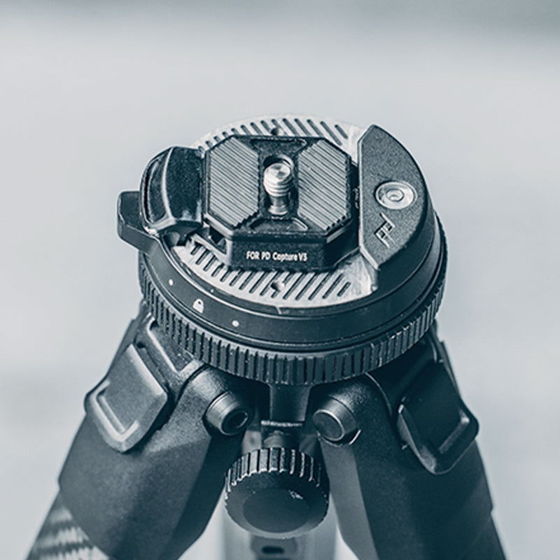 Falcam F38 quick release plate mounted on tripod for stability.