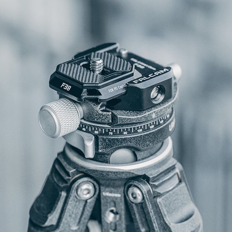 Falcam F38 quick release plate on tripod head for secure camera stability