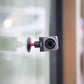 Ulanzi U-170 Magnetic Quick Release Head with DJI Action Camera, attached to glass surface.