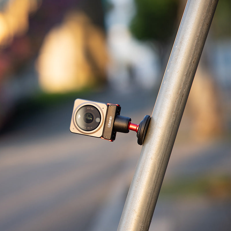 Ulanzi U-170 Magnetic Quick Release Head for DJI Action Camera, black and red design, on pole.
