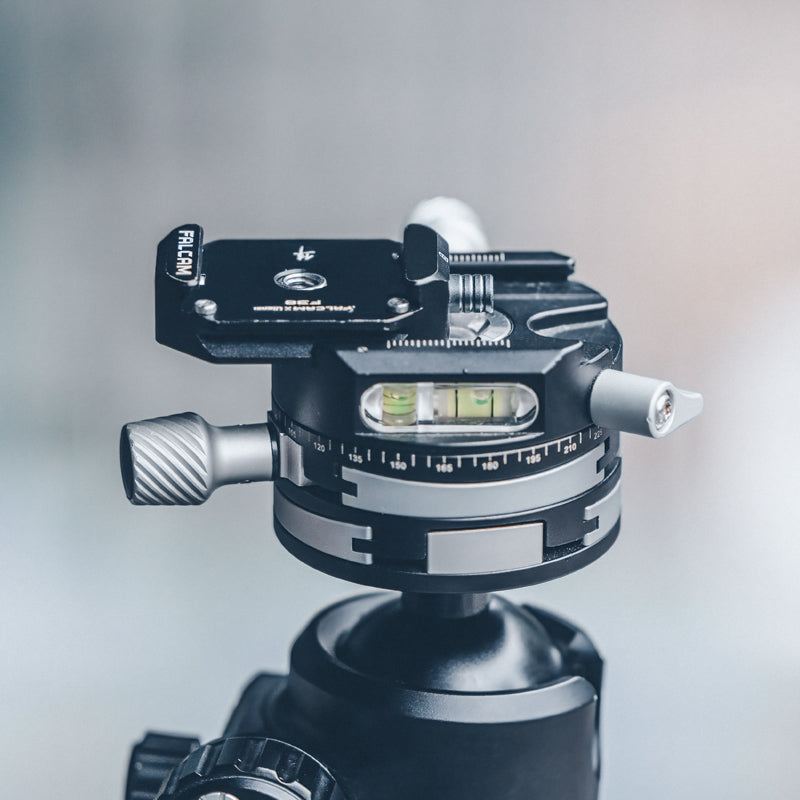 Falcam F38 Quick Release Bottom Plate mounted on tripod with spirit level