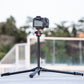Ulanzi Ombra YING Travel Tripod set up with camera outdoors, showcasing stable design.