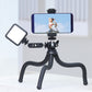 Smartphone on Ulanzi tripod with LED light for video recording.