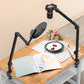 Ulanzi LS25 desk arm supporting a camera over a book and plate on a wooden table.