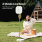 Woman using mobile live room stand for outdoor streaming in a park
