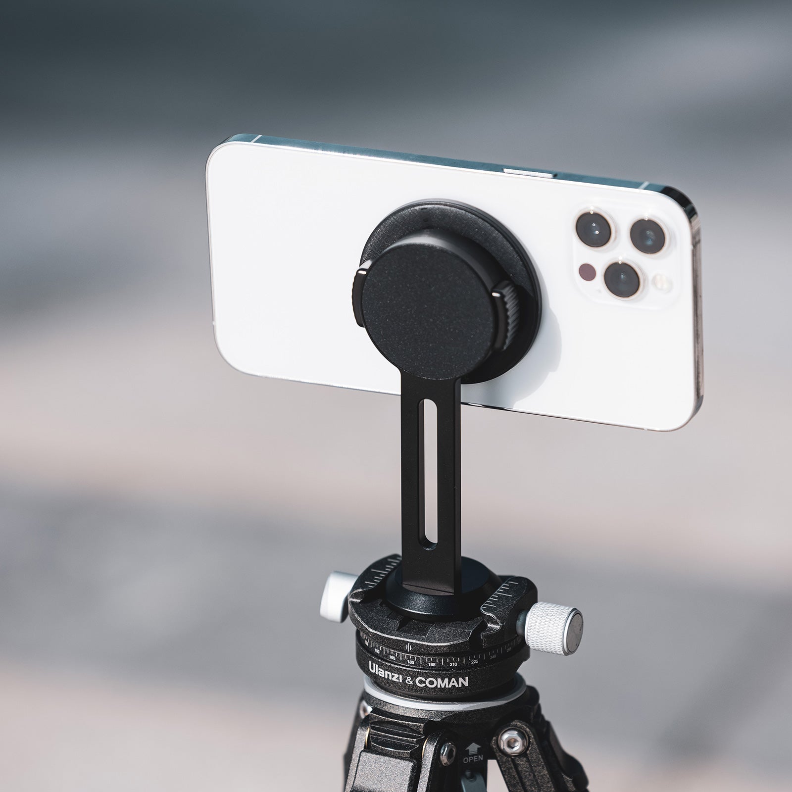 Ulanzi O-LOCK Phone Magnetic Sticker attached to smartphone on tripod